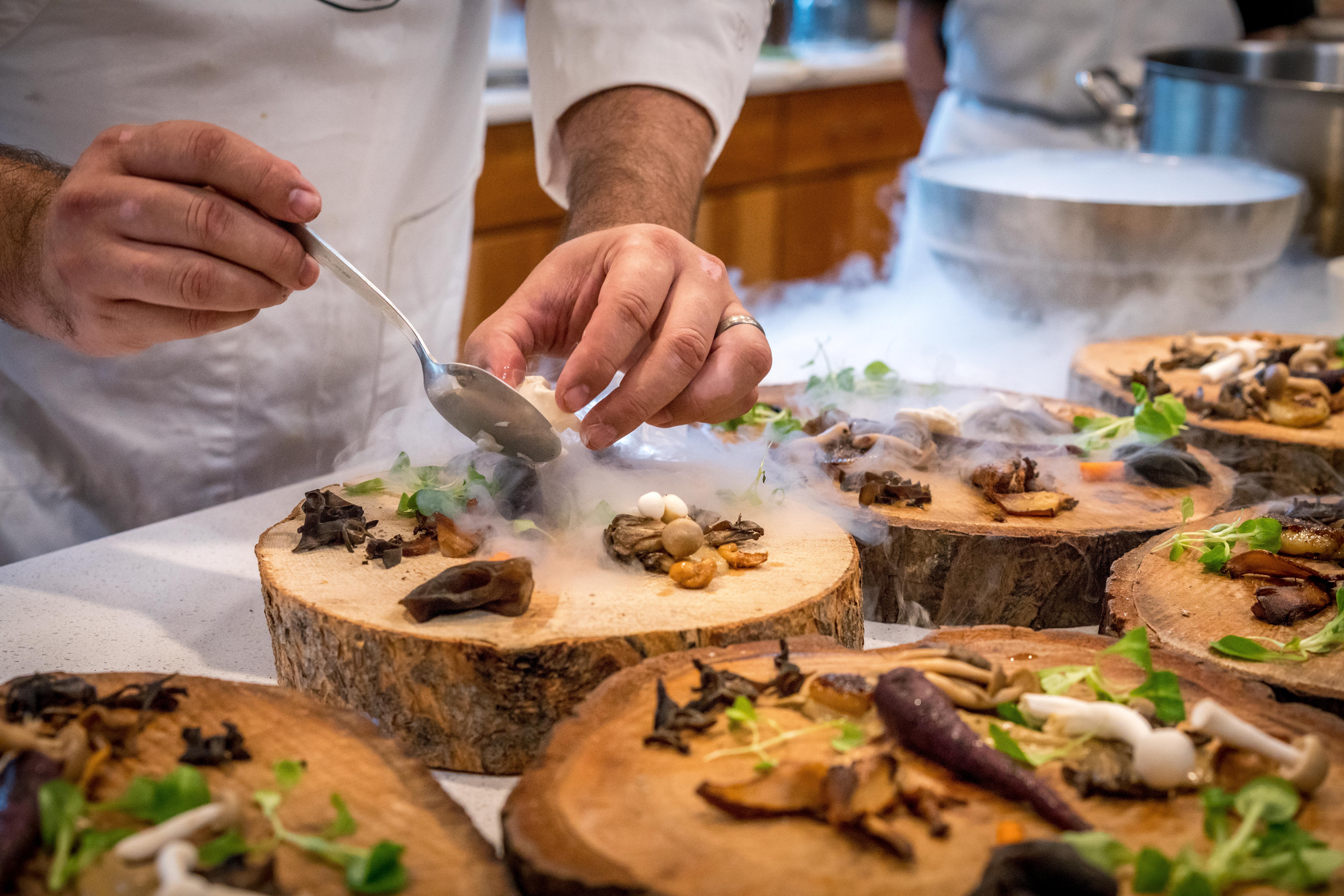 Chef Preparing Vegetable Dish On Tree Slab 1267320